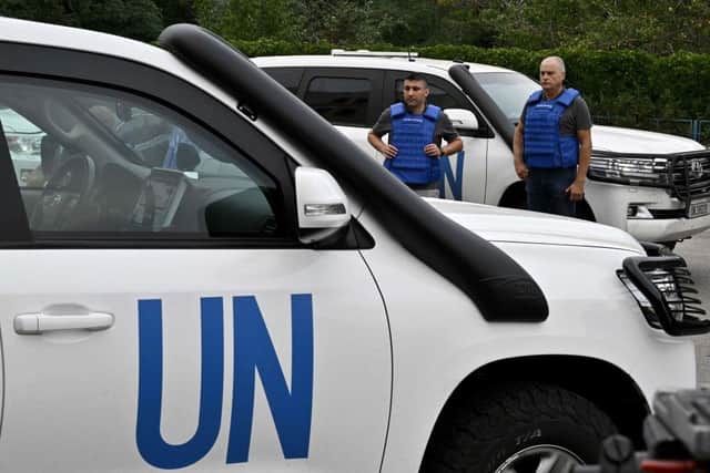 United Nations' vehicles carrying members of the International Atomic Energy Agency (IAEA) inspection mission wait to leave the city of Zaporizhzhia, as UN inspectors prepare to head to the Russian-held Zaporizhzhia nuclear power plant in southern Ukraine.