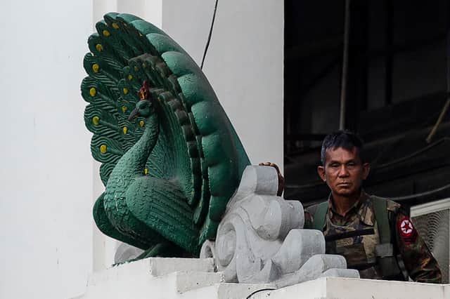 A soldier stands guard in City Hall in Yangon on Monday, after Myanmar's military seized power