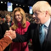 Boris Johnson is congratulated by his father Stanley Johnson after delivering his keynote speech on the final day of the annual Conservative Party conference in Manchester in 2019 (Picture: Stefan Rousseau/pool/AFP via Getty Images)