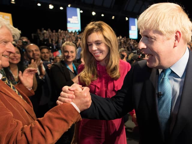 Boris Johnson is congratulated by his father Stanley Johnson after delivering his keynote speech on the final day of the annual Conservative Party conference in Manchester in 2019 (Picture: Stefan Rousseau/pool/AFP via Getty Images)