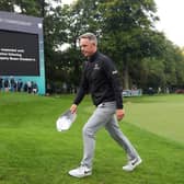 Luke Donald leaves the 18th green on Thursday night following the announcement of the death of Her Majesty Queen Elizabeth II during day one of the BMW PGA Championship. Picture: Warren Little/Getty Images.