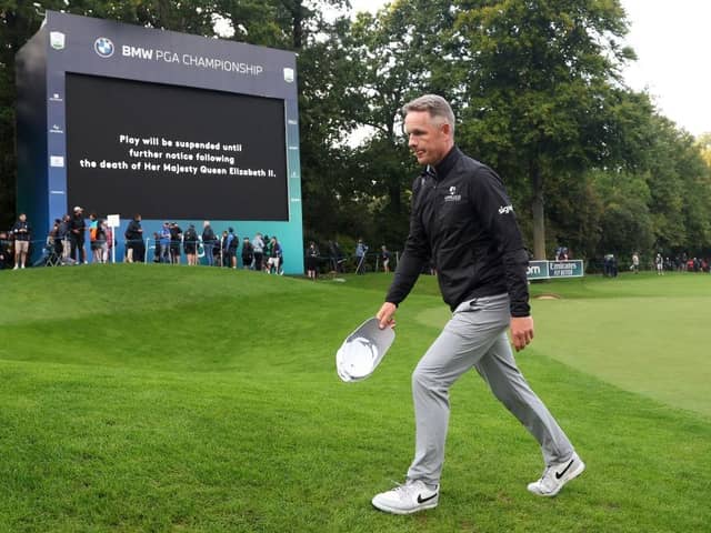 Luke Donald leaves the 18th green on Thursday night following the announcement of the death of Her Majesty Queen Elizabeth II during day one of the BMW PGA Championship. Picture: Warren Little/Getty Images.