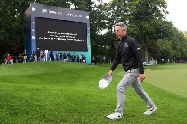 Luke Donald leaves the 18th green on Thursday night following the announcement of the death of Her Majesty Queen Elizabeth II during day one of the BMW PGA Championship. Picture: Warren Little/Getty Images.