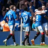 John Souttar is mobbed by his Rangers team-mates after scoring the second goal of the game against Celtic.