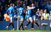 John Souttar is mobbed by his Rangers team-mates after scoring the second goal of the game against Celtic.