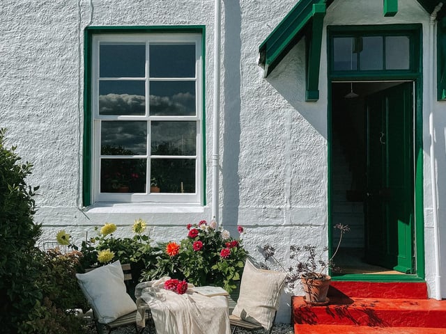 Originally built around 150 years ago to service naval officer’s lodgings, the Rhu Boathouse is now home to Patricia and Patrick and their dog, Alva.