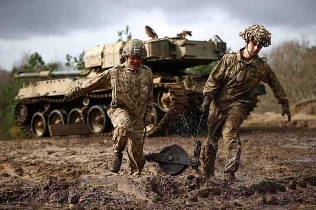 Soldiers take part in a military exercise at the Longmoor training area, Hampshire, in March (Picture: Adrian Dennis/AFP via Getty Images)