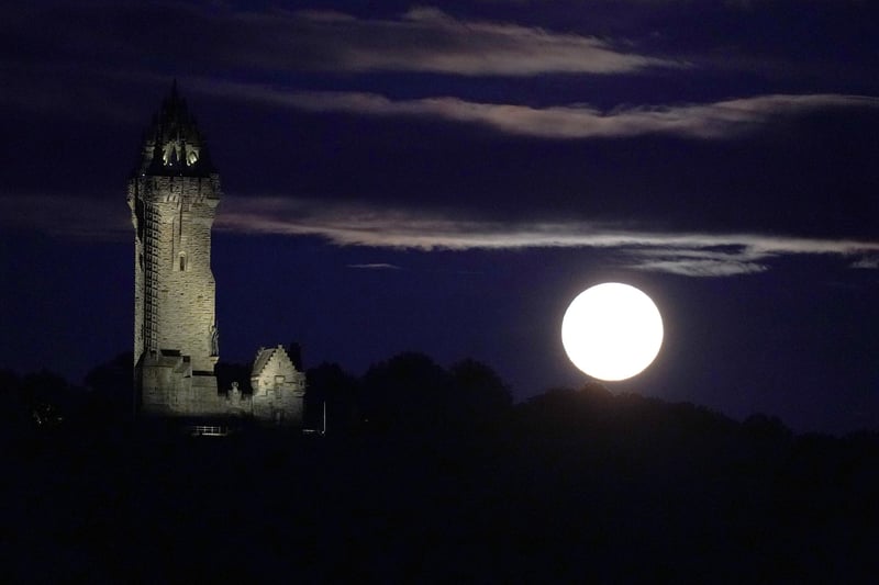 The super blue moon rises over The Wallace Monument in Stirling. (Photo: Andrew Milligan/PA Wire)