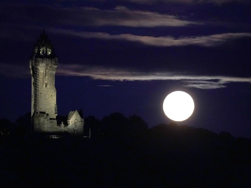 The super blue moon rises over The Wallace Monument in Stirling. (Photo: Andrew Milligan/PA Wire)