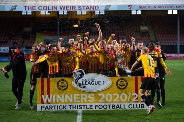 Partick Thistle players celebrate winning the Scottish league one title at Firhill . (Photo by Craig Foy / SNS Group)
