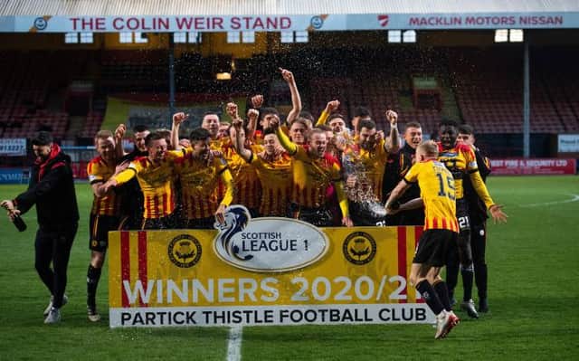 Partick Thistle players celebrate winning the Scottish league one title at Firhill . (Photo by Craig Foy / SNS Group)