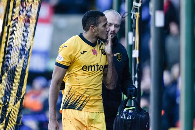 Livingston's Cristian Montano blows a kiss at Rangers fans as he makes his way round to the dugout.