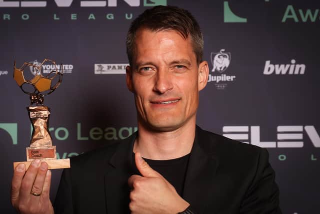 Oostende head coach Alexander Blessin with his Manager of the Year trophy at the Belgian Pro League Awards ceremony on Monday night. (Photo by VIRGINIE LEFOUR/BELGA MAG/AFP via Getty Images)