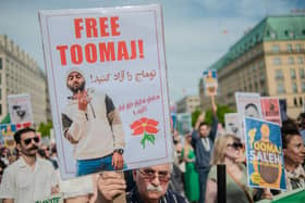 Protesters in Berlin call for Iranian rapper Toomaj Salehi, sentenced to death for mocking the Iranian regime in his songs and supporting the popular protests against them, to be freed (Picture: Babak Bordbar/Middle East Images/AFP via Getty Images)