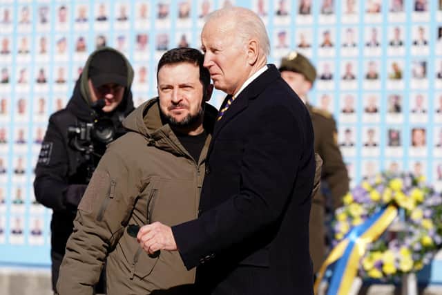 US President Joe Biden (R) is greeted by Ukrainian President Volodymyr Zelensky (L) during a surprise visit to Kyiv.