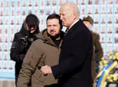 US President Joe Biden (R) is greeted by Ukrainian President Volodymyr Zelensky (L) during a surprise visit to Kyiv.