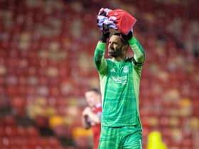 Aberdeen's Joe Lewis applauds the fans at full time during a Cinch Premiership match between Aberdeen and Dundee at Pittodrie Stadium, on December 26, 2021, in Aberdeen, Scotland. (Photo by Ross MacDonald / SNS Group)