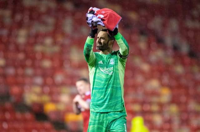 Aberdeen's Joe Lewis applauds the fans at full time during a Cinch Premiership match between Aberdeen and Dundee at Pittodrie Stadium, on December 26, 2021, in Aberdeen, Scotland. (Photo by Ross MacDonald / SNS Group)