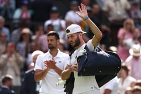 Jacob Fearnley acknowledges the Wimbledon crowd as he leaves Centre Court following defeat against Novak Djokovic. (Photo by Francois Nel/Getty Images)