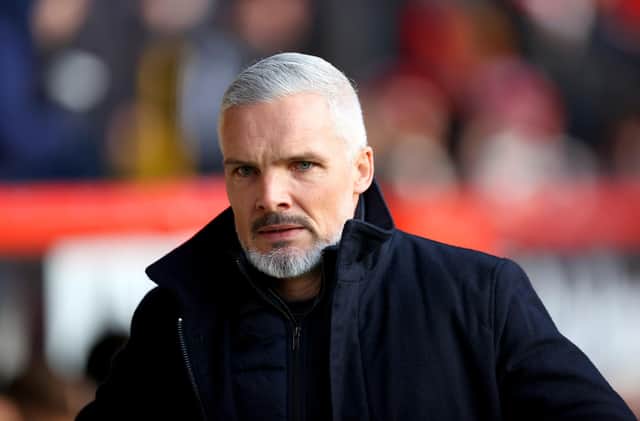 Jim Goodwin, who insists he just needs time to complete Aberdeen's "transition" rather than assurances over his job following Wednesday's 5-0 defeat by Hearts.