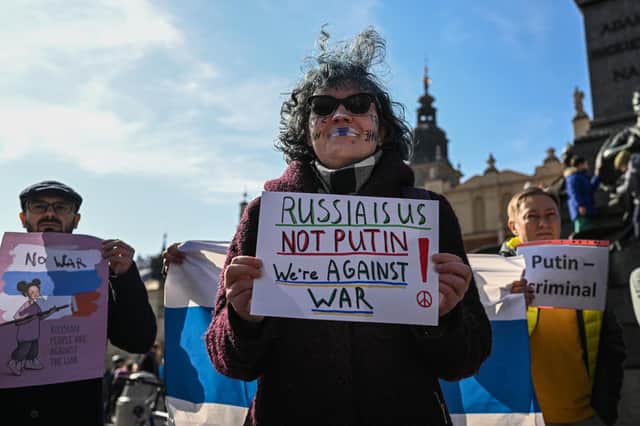Russians protest against Vladimir Putin's war on Ukraine but in Krakow, Poland, not Russia, where they would be quickly arrested (Picture: Omar Marques/Getty Images)