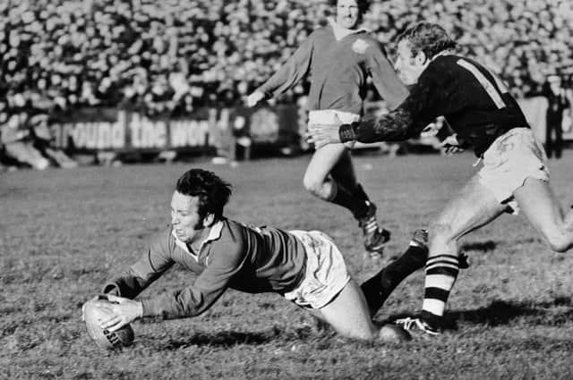 Lions captain John Dawes gets over the line for a try despite the efforts of Otago winger Bruce Hunter during the 1971 tour of New Zealand. Picture: Central Press/Hulton Archive/Getty Images