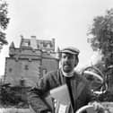 The late folk musician Marc Ellington at his family home,  Towie Barclay Castle in Aberdeenshire, which has now gone on the market.