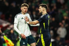 Northern Ireland's Conor Bradley and Kieran Tierney clash during an International Friendly match between Scotland and Northern Ireland at Hampden Park, on March 26, 2024, in Glasgow, Scotland. (Photo by Craig Williamson / SNS Group)