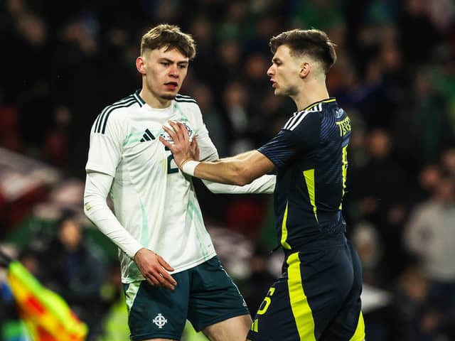 Northern Ireland's Conor Bradley and Kieran Tierney clash during an International Friendly match between Scotland and Northern Ireland at Hampden Park, on March 26, 2024, in Glasgow, Scotland. (Photo by Craig Williamson / SNS Group)