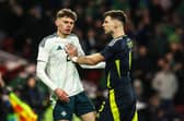 Northern Ireland's Conor Bradley and Kieran Tierney clash during an International Friendly match between Scotland and Northern Ireland at Hampden Park, on March 26, 2024, in Glasgow, Scotland. (Photo by Craig Williamson / SNS Group)