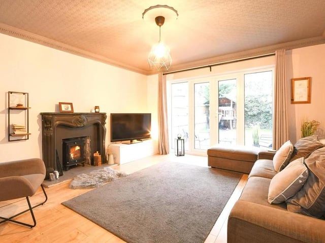 This is the sizeable but cosy living room that attaches itself to the kitchen/diner. A lovely feature fireplace is a key part of the room.