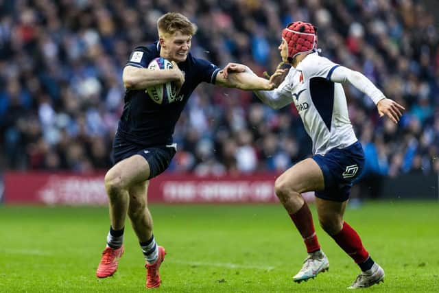 Scotland debutant Harry Paterson holds off France's Louis Bielle-Biarrey during the Guinness Six Nations match at Scottish Gas Murrayfield Stadium. (Photo by Ross MacDonald / SNS Group)