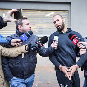 According to one poll, more than a quarter of young men have a favourable opinion of social media misogynist Andrew Tate, currently under house arrest in Romania amid an investigation into human trafficking (Picture: Mihai Barbu/AFP via Getty Images)