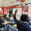 The number of pupils absent from school in Scotland due to Covid-related reasons has risen by a third in the past week