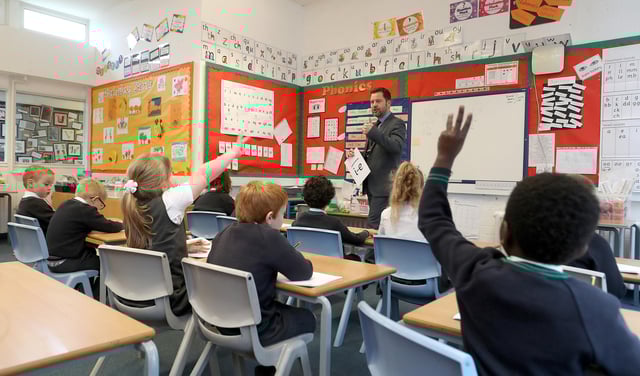 The number of pupils absent from school in Scotland due to Covid-related reasons has risen by a third in the past week