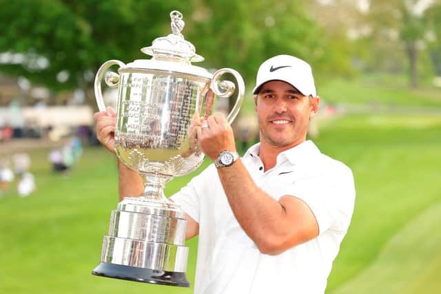 Brooks Koepka shows off the Wanamaker Trophy after winning the 105th PGA Championship at Oak Hill Country Club in Rochester, New York. Picture: Kevin C. Cox/Getty Images.