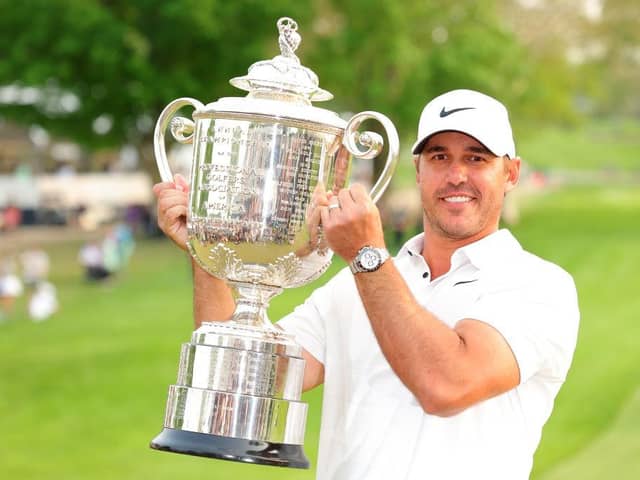 Brooks Koepka shows off the Wanamaker Trophy after winning the 105th PGA Championship at Oak Hill Country Club in Rochester, New York. Picture: Kevin C. Cox/Getty Images.