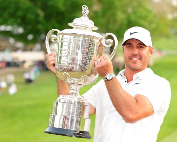 Brooks Koepka shows off the Wanamaker Trophy after winning the 105th PGA Championship at Oak Hill Country Club in Rochester, New York. Picture: Kevin C. Cox/Getty Images.
