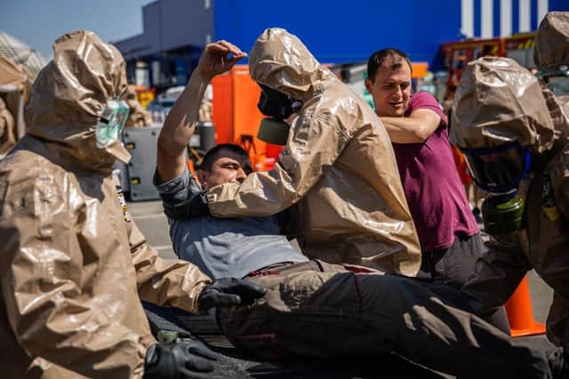 Ukrainian Emergency Ministry rescuers attend an exercise in the city of Zaporizhzhia on August 17, in case of a possible nuclear incident at the Zaporizhzhia nuclear power plant located near the city.