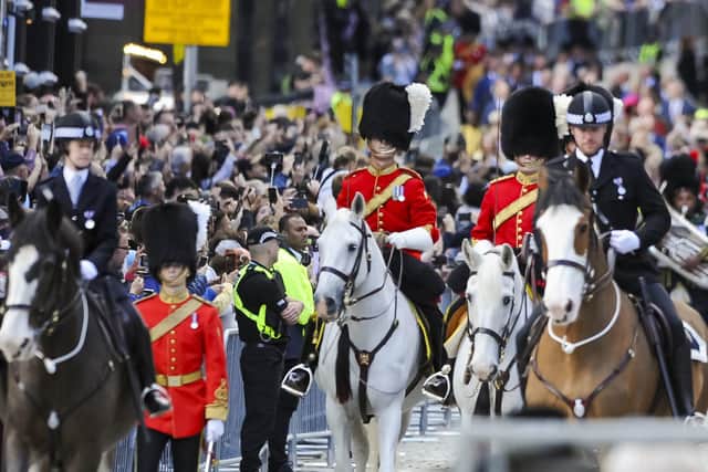 The royal procession makes its way up the Royal Mile in Edinburgh to St Giles' Cathedral. Picture: Lisa Ferguson/PA Wire