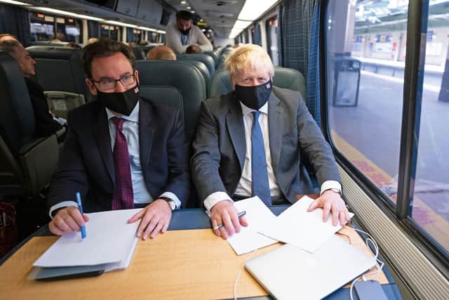 Prime Minister Boris Johnson, accompanied by aide David Blair (left), travels on a train from Penn Station in New York to Washington DC where he will meet US president Joe Biden. Picture: Stefan Rousseau/PA Wire