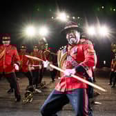 Members of the US Air Force Honor Guard Drill Team perform on the esplanade of Edinburgh Castle at this year's Royal Edinburgh Military Tattoo. Picture: Jane Barlow/PA Wire
