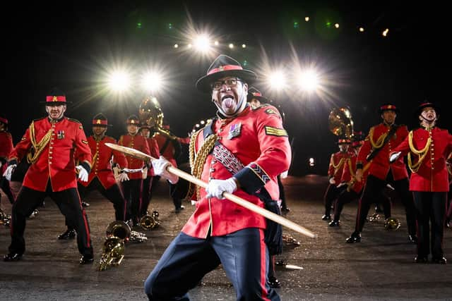 Members of the US Air Force Honor Guard Drill Team perform on the esplanade of Edinburgh Castle at this year's Royal Edinburgh Military Tattoo. Picture: Jane Barlow/PA Wire