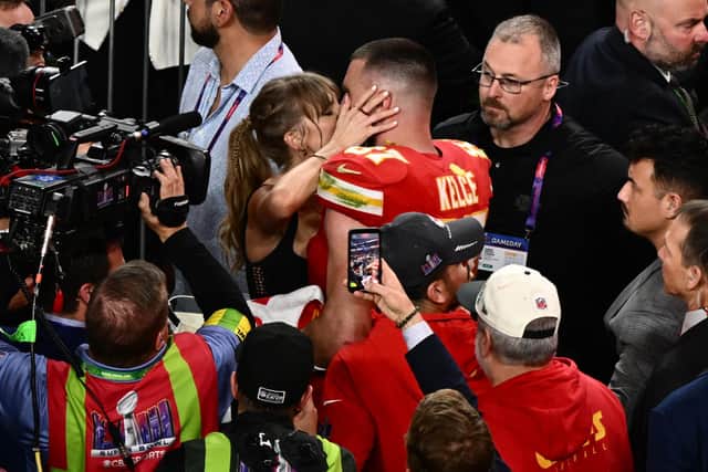 Taylor Swift kisses Kansas City Chiefs' tight Travis Kelce after the Chiefs won Super Bowl LVIII against the San Francisco 49ers at Allegiant Stadium in Las Vegas.