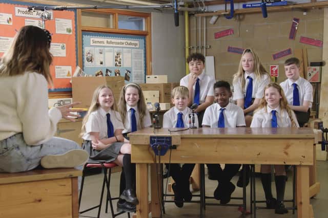 BBC presenter Lauren Layfield with school children in Let Talk About Periods.