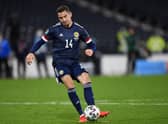Kenny McLean scores the decisive fifth penalty to win the shootout against Israel.