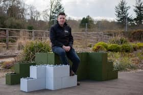 Andrew Vincent with the building blocks, which are made from recycled plastic. Picture: 360 Bid