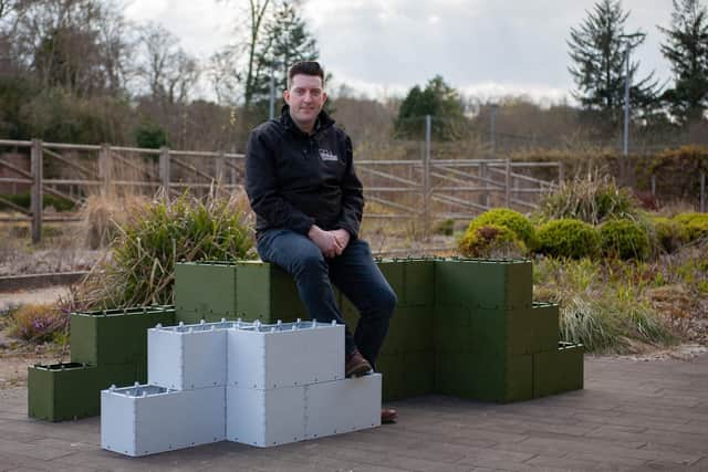 Andrew Vincent with the building blocks, which are made from recycled plastic. Picture: 360 Bid