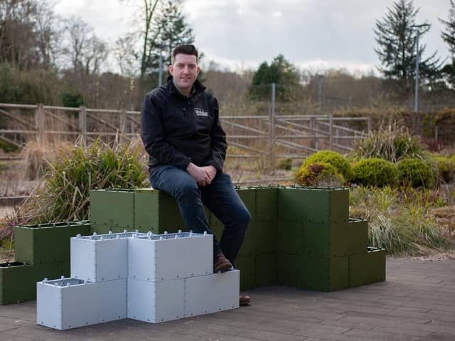 Andrew Vincent with the building blocks, which are made from recycled plastic. Picture: 360 Bid