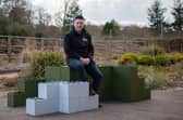 Andrew Vincent with the building blocks, which are made from recycled plastic. Picture: 360 Bid